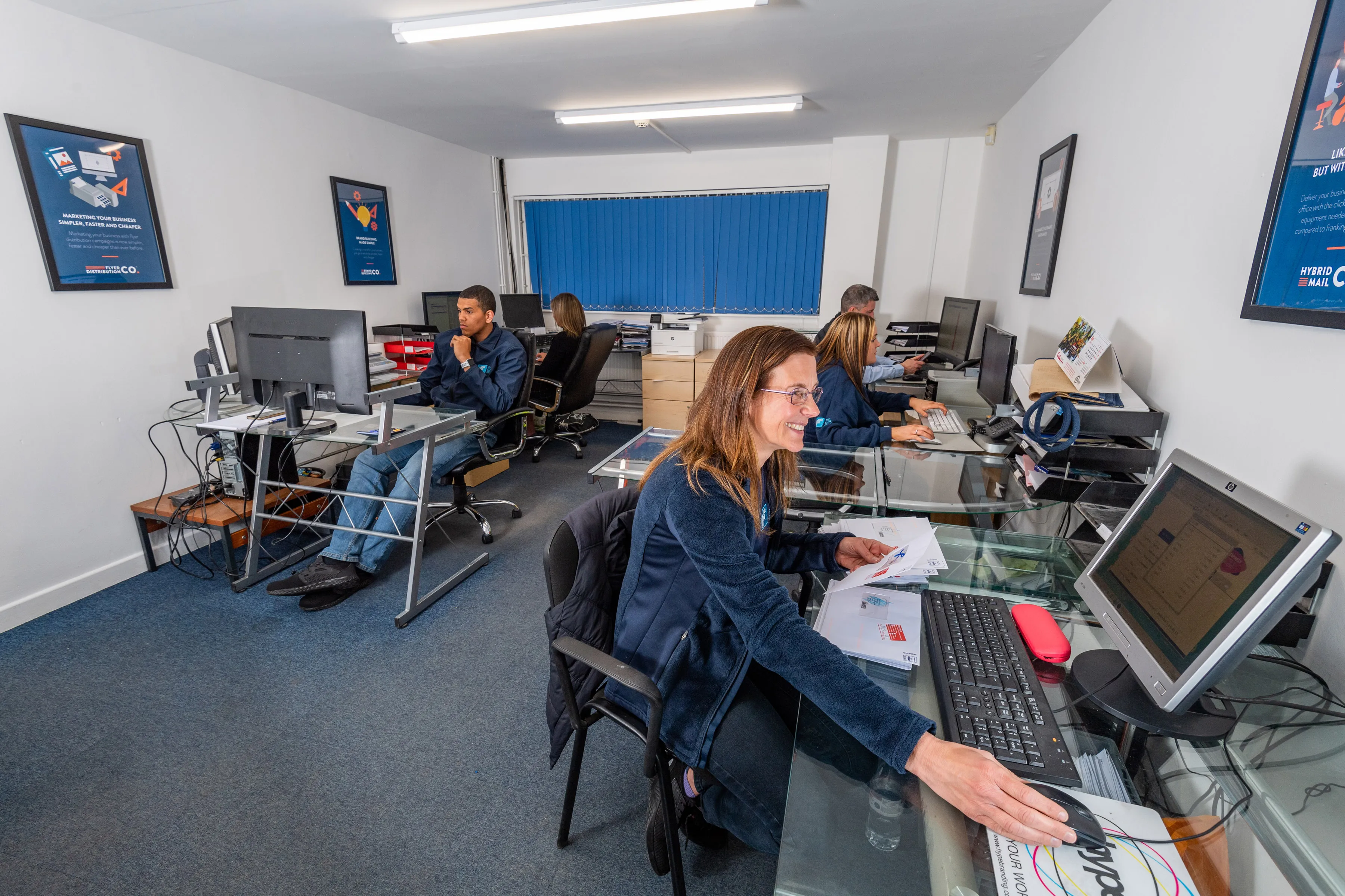 Flow Group T1 office with employees actively taking calls at their desks.