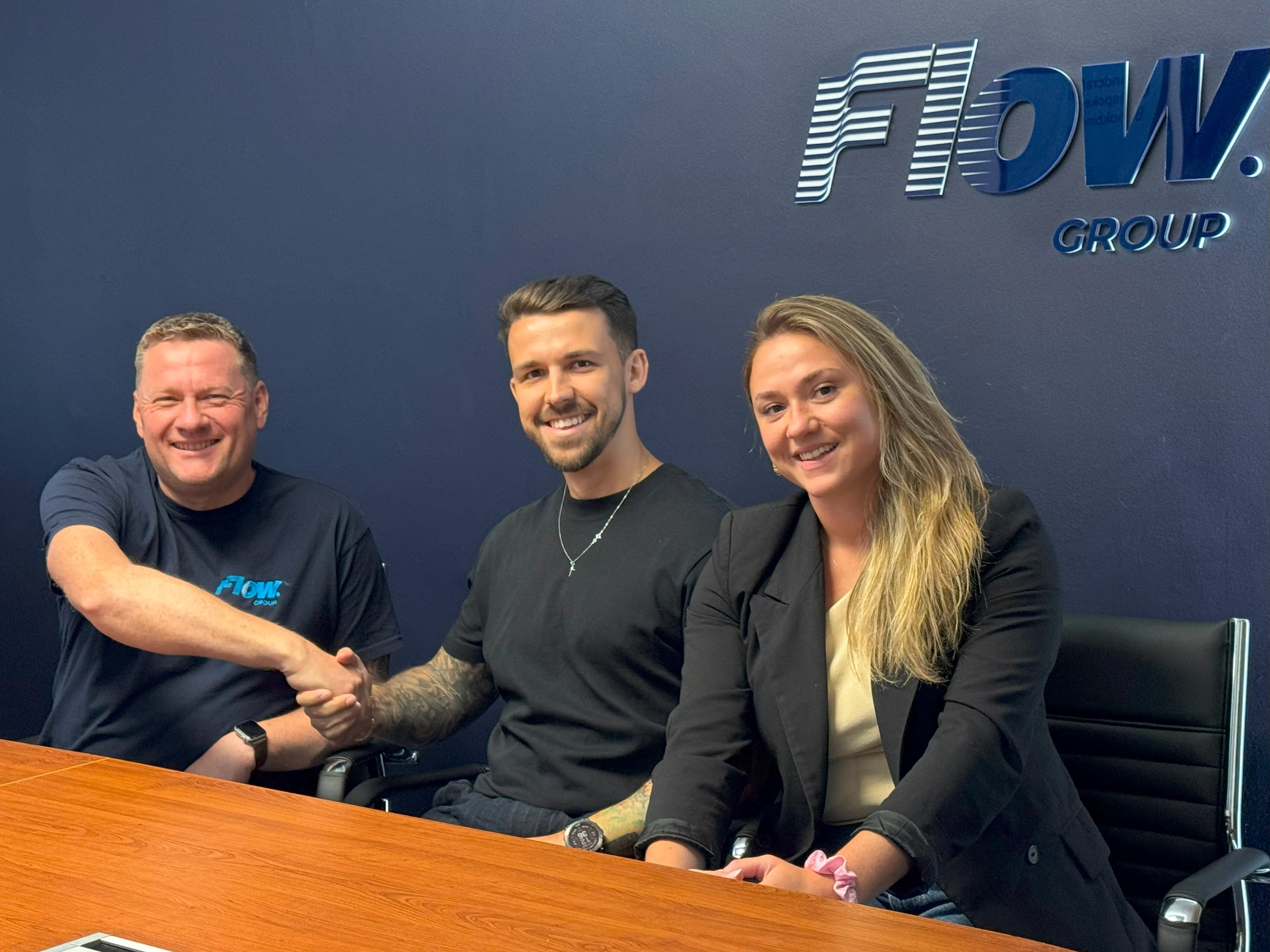 3 people shaking hands