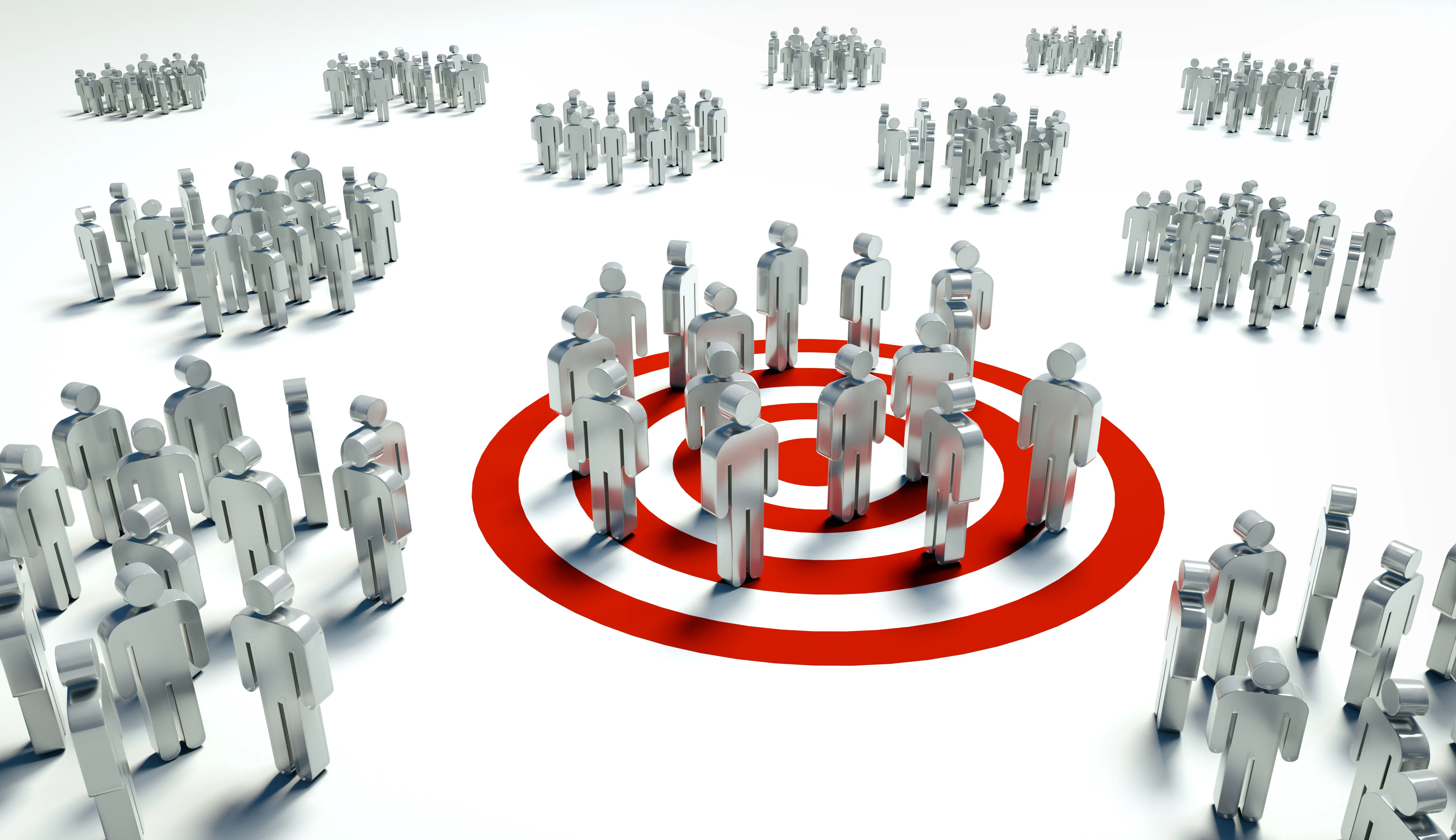 Groups of silver metallic human figures with one group standing together on a red and white target symbol.