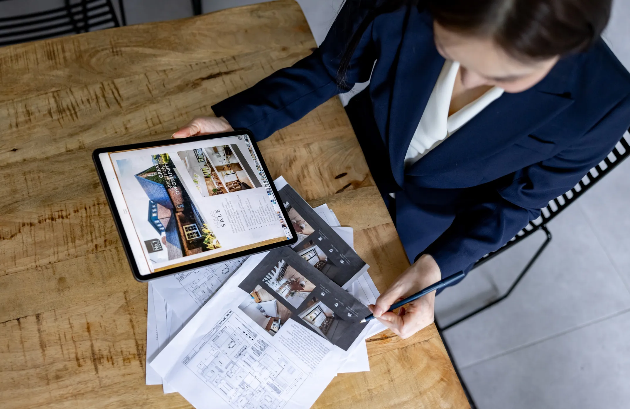 a mans hand typing on a laptop