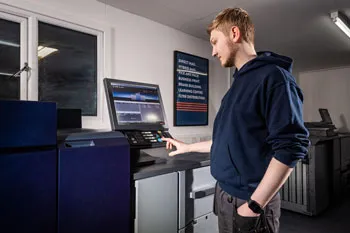 a person operating a printer