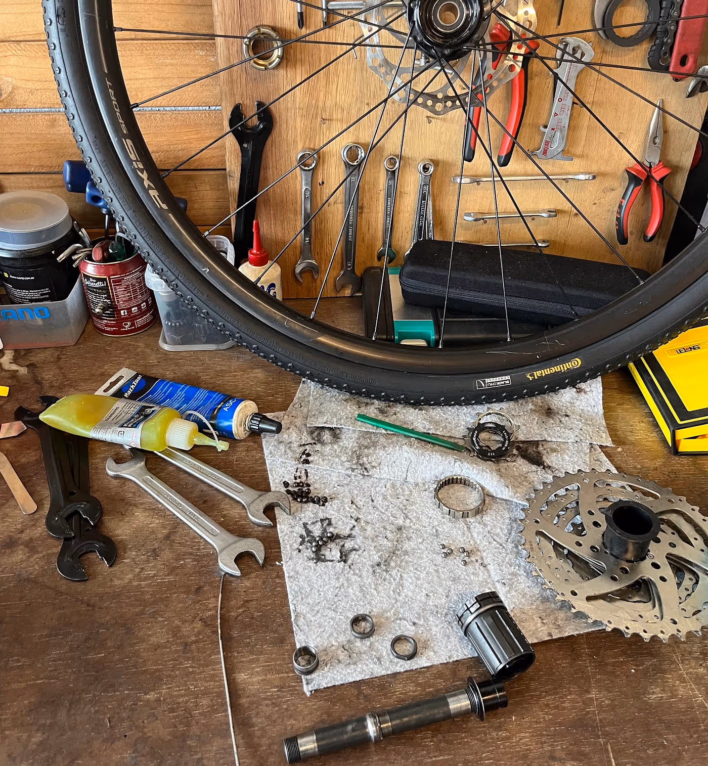 bike wheel on table with tools