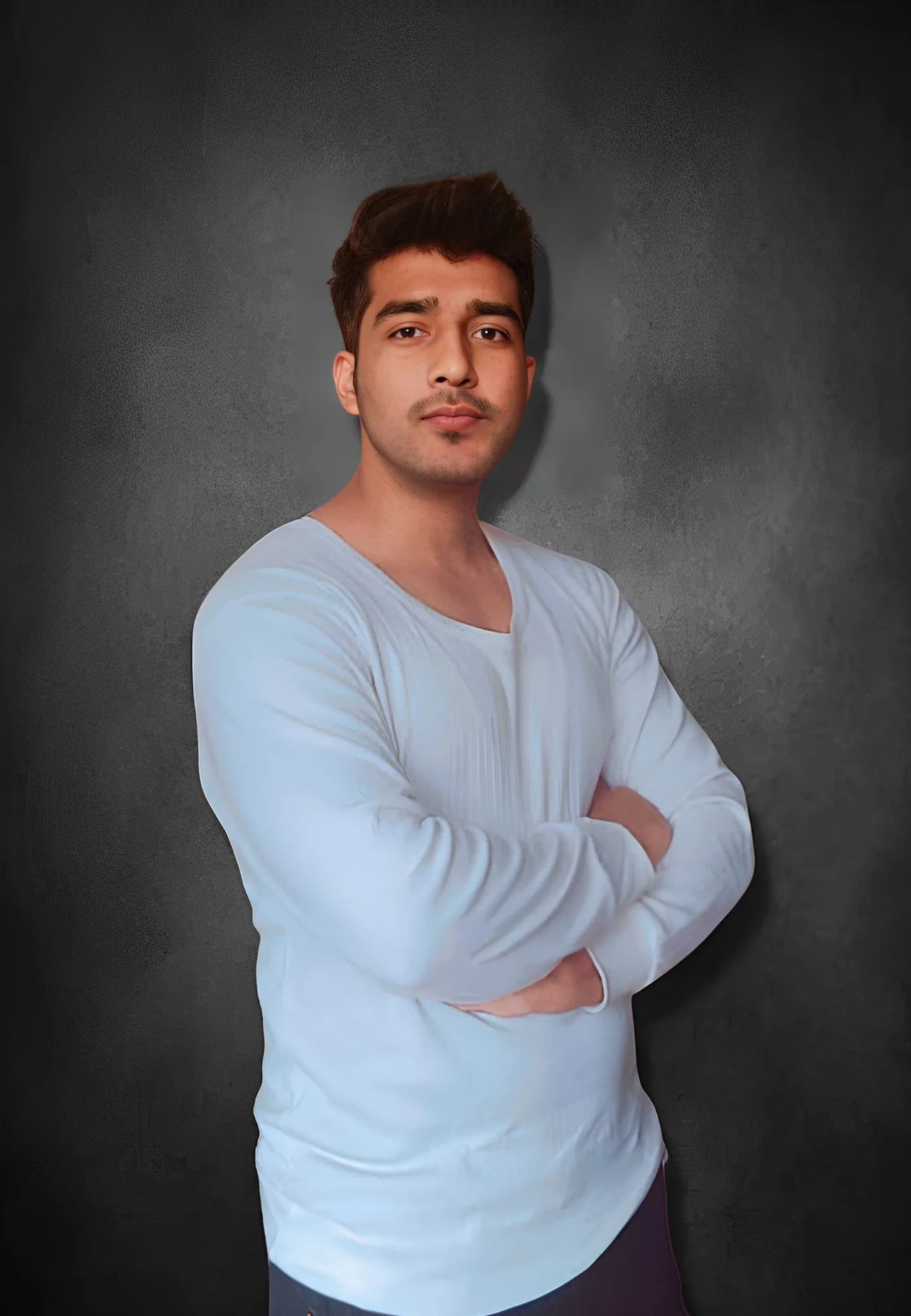 A man standing wearing a white shirt with arms tied posing for camera