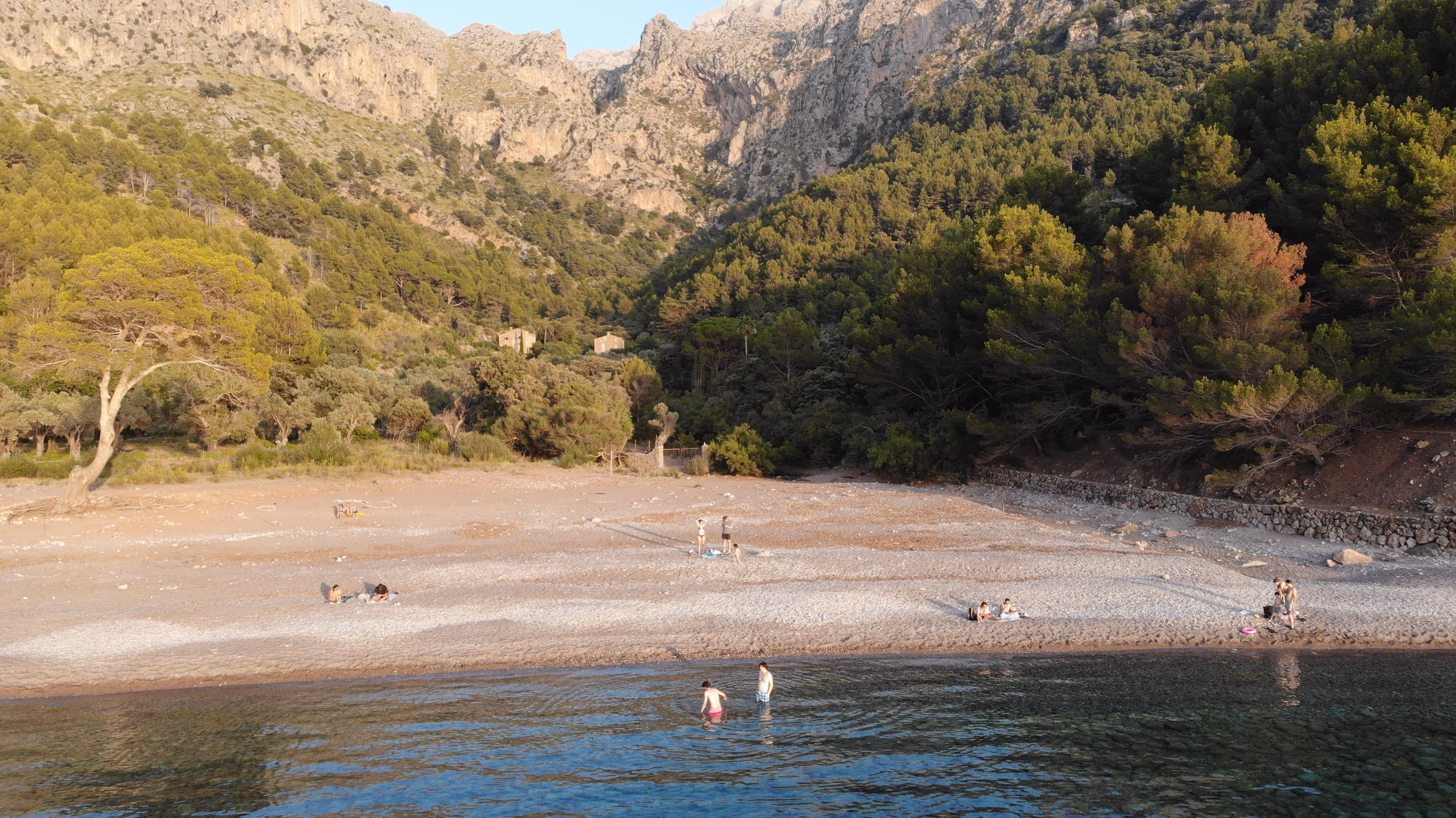 Beach of Cala Tuent overlooking the mountains and the stunning natural landscape of Mallorca.