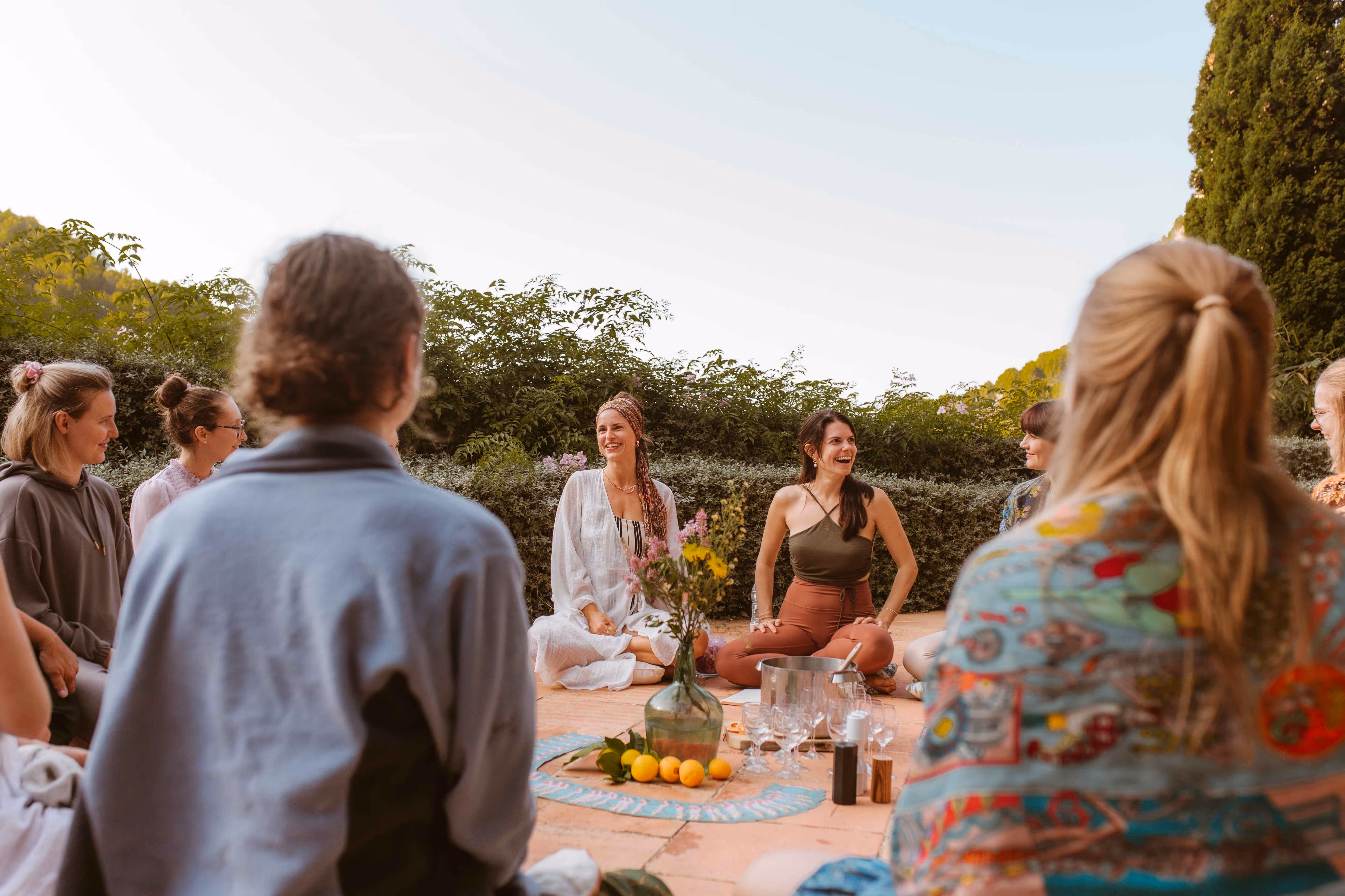Yoga teacher guiding a session on the terrace at Finca Higo, surrounded by retreat participants.