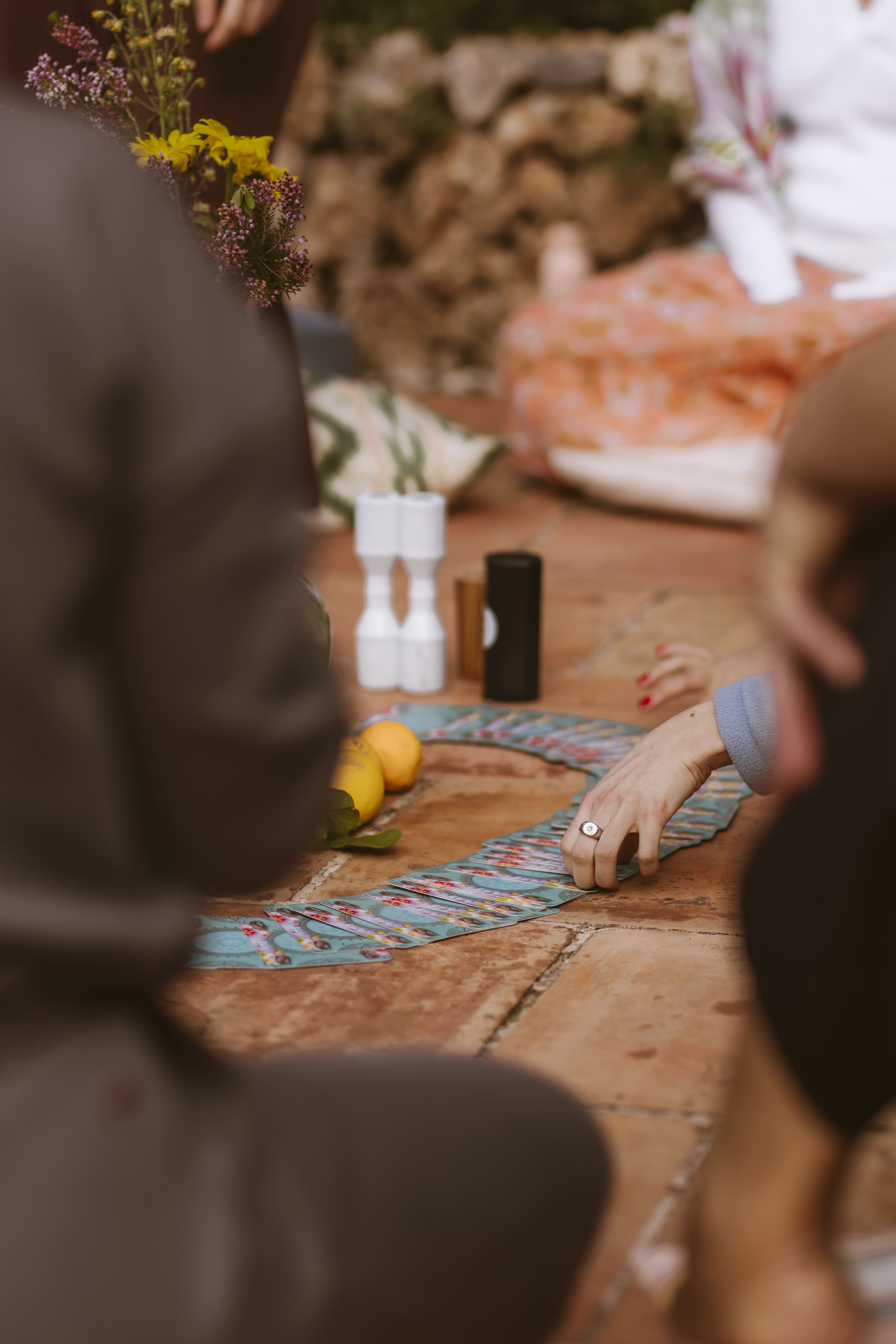 Rustic outdoor table with homemade lemonade and lemons at Finca Higo, set against historic stone walls.