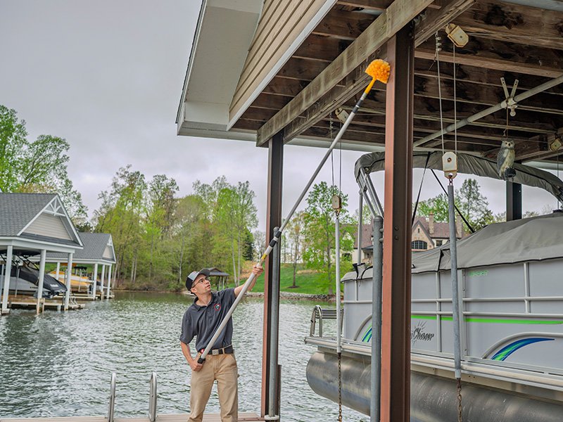 technician removing spider webs smith lake