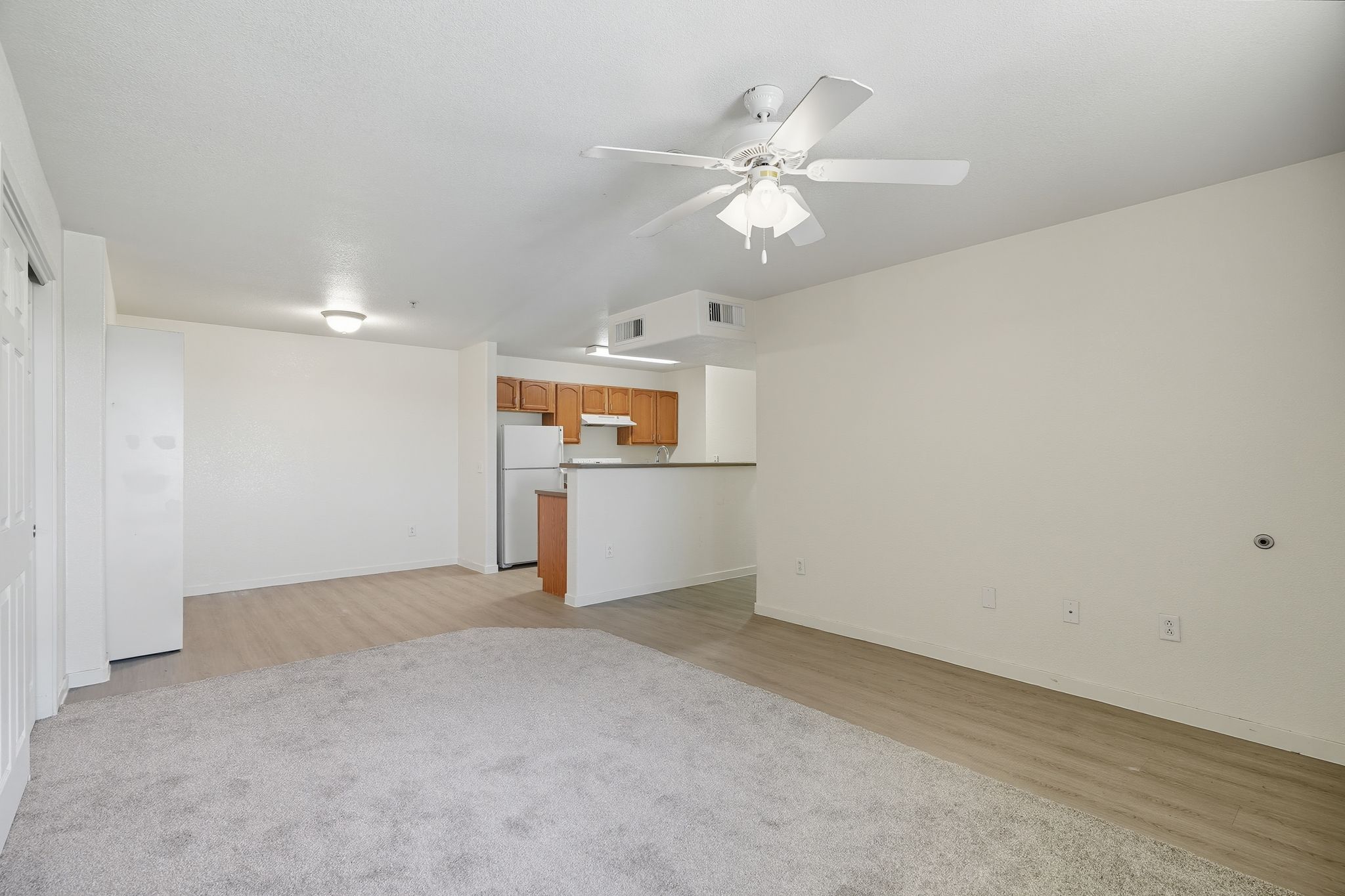 living area with view of kitchen and dining area