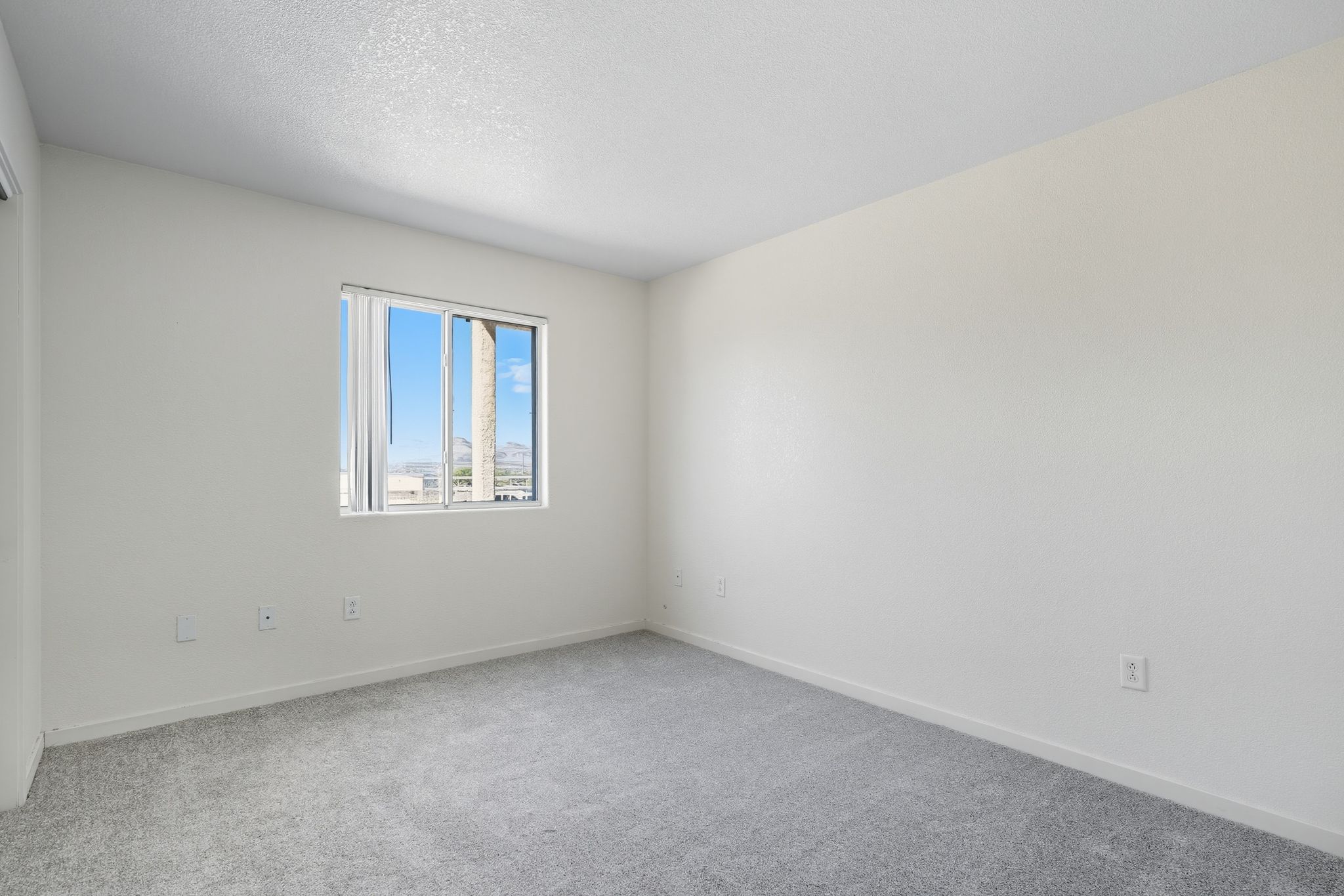unfurnished bedroom with window
