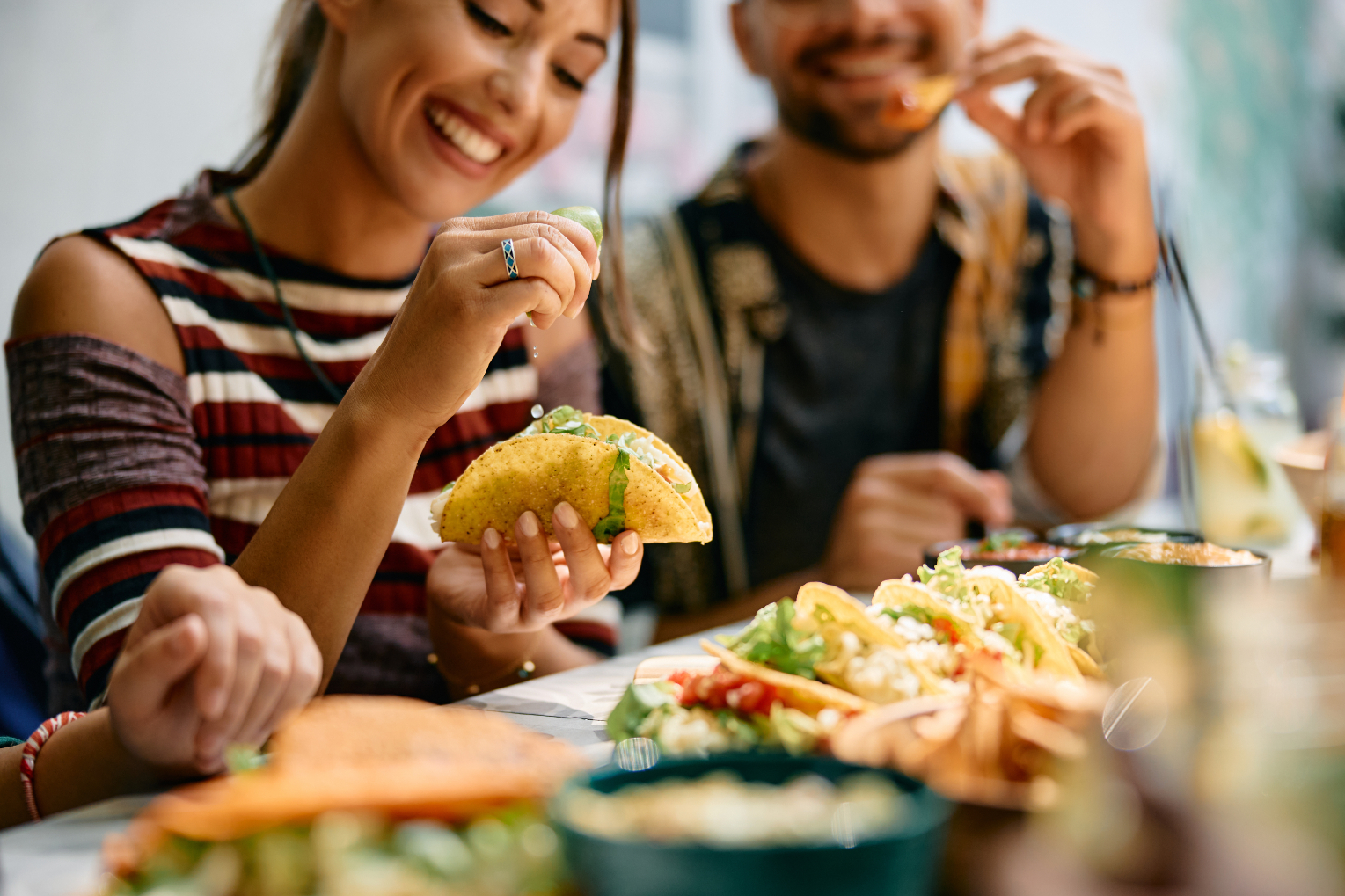 Couple eating tacos stock image