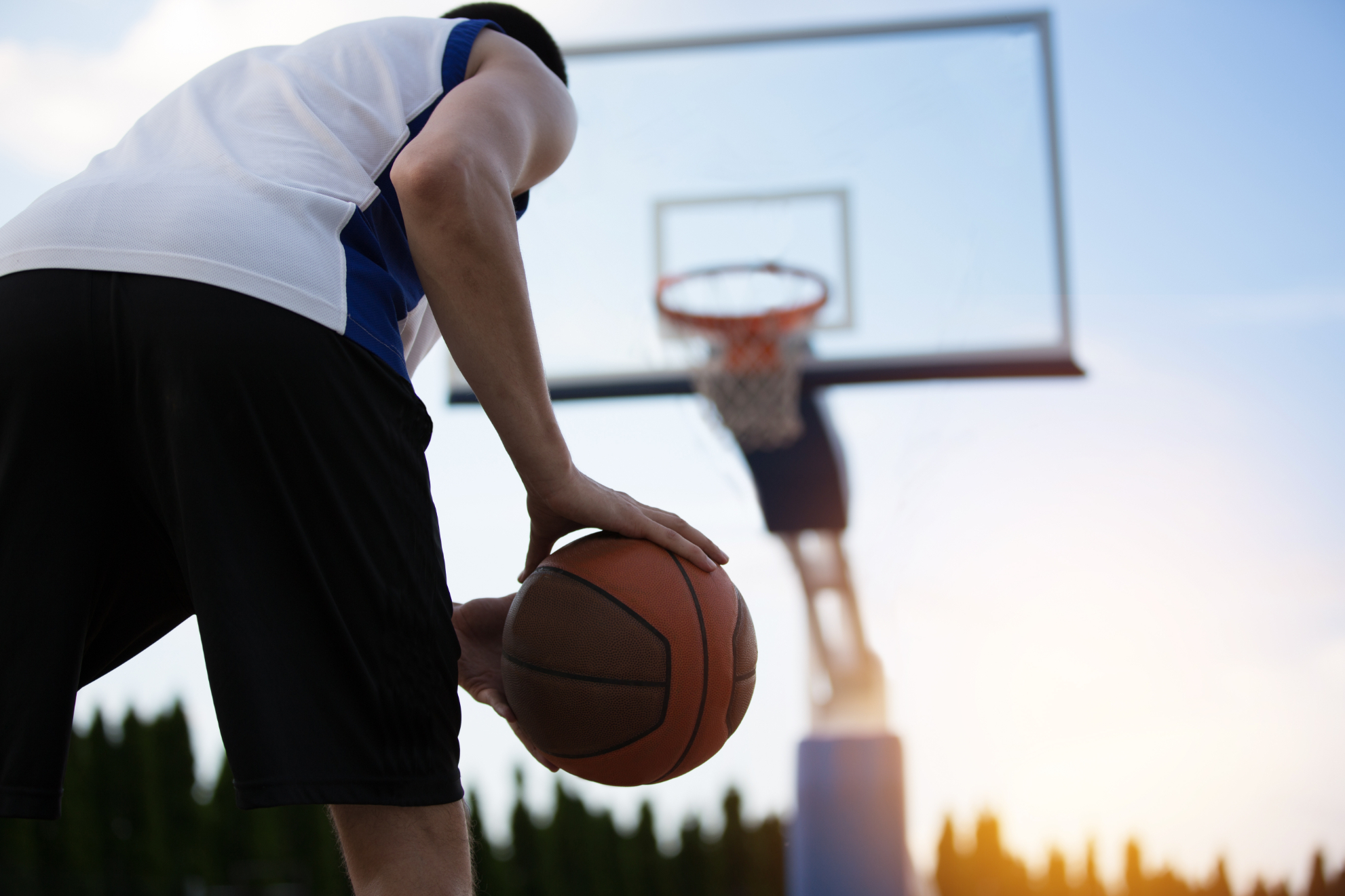 Man on Basketball Court with basketball stock image