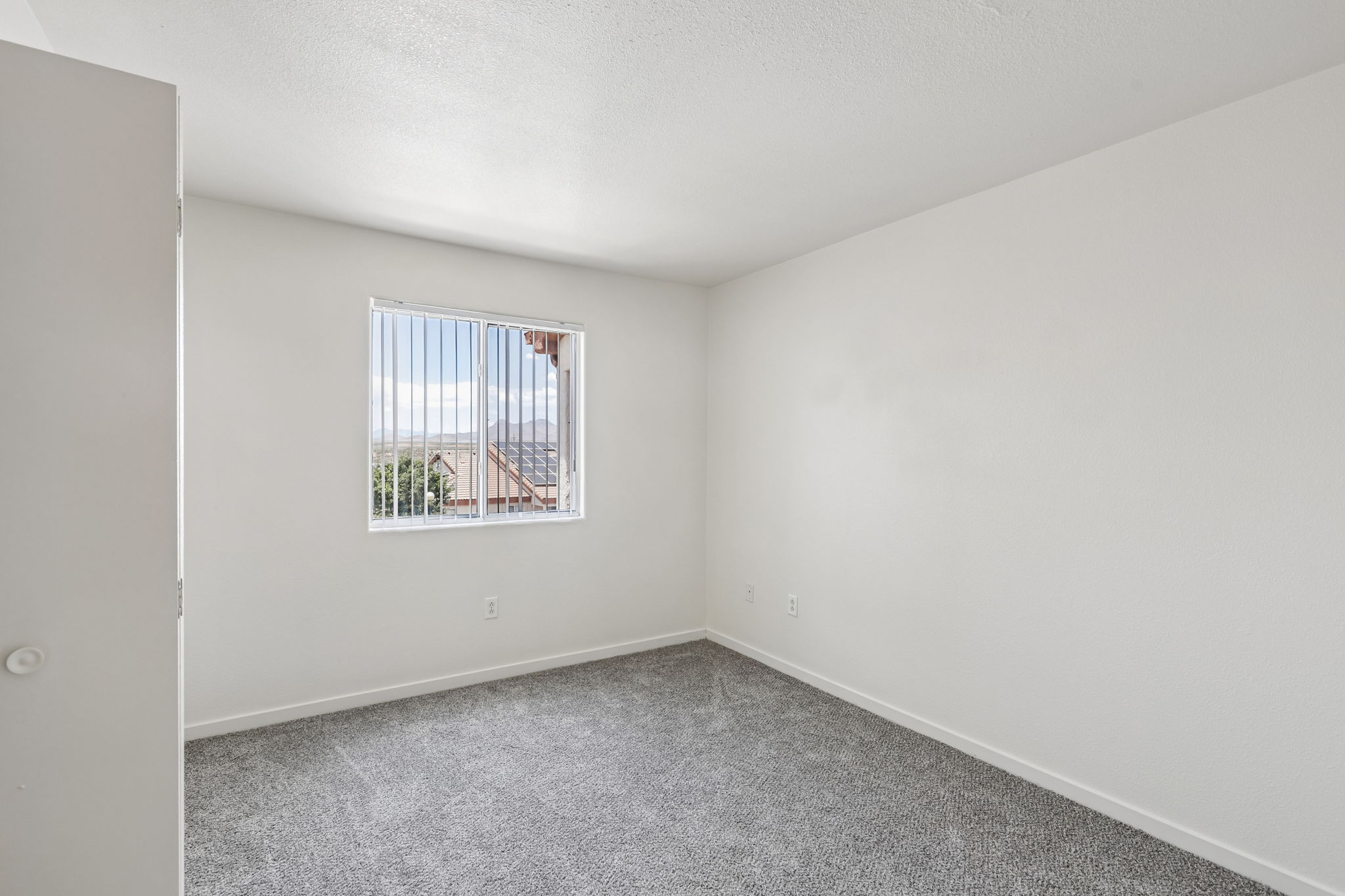 unfurnished bedroom with window