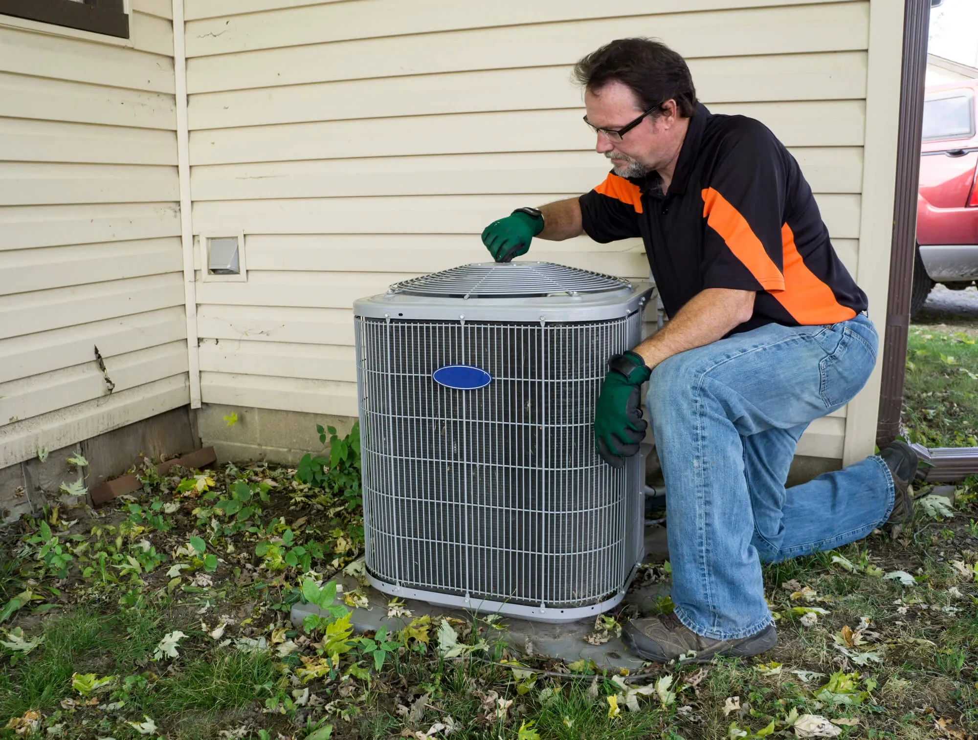 A-TEMP technician installing a new furnace and AC system at a Portland, OR home