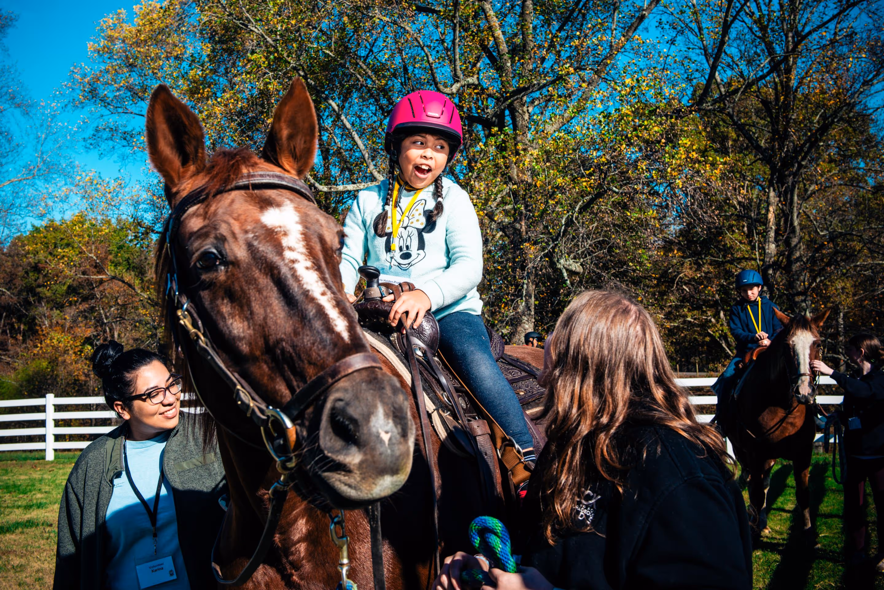 Excited girl riding horse