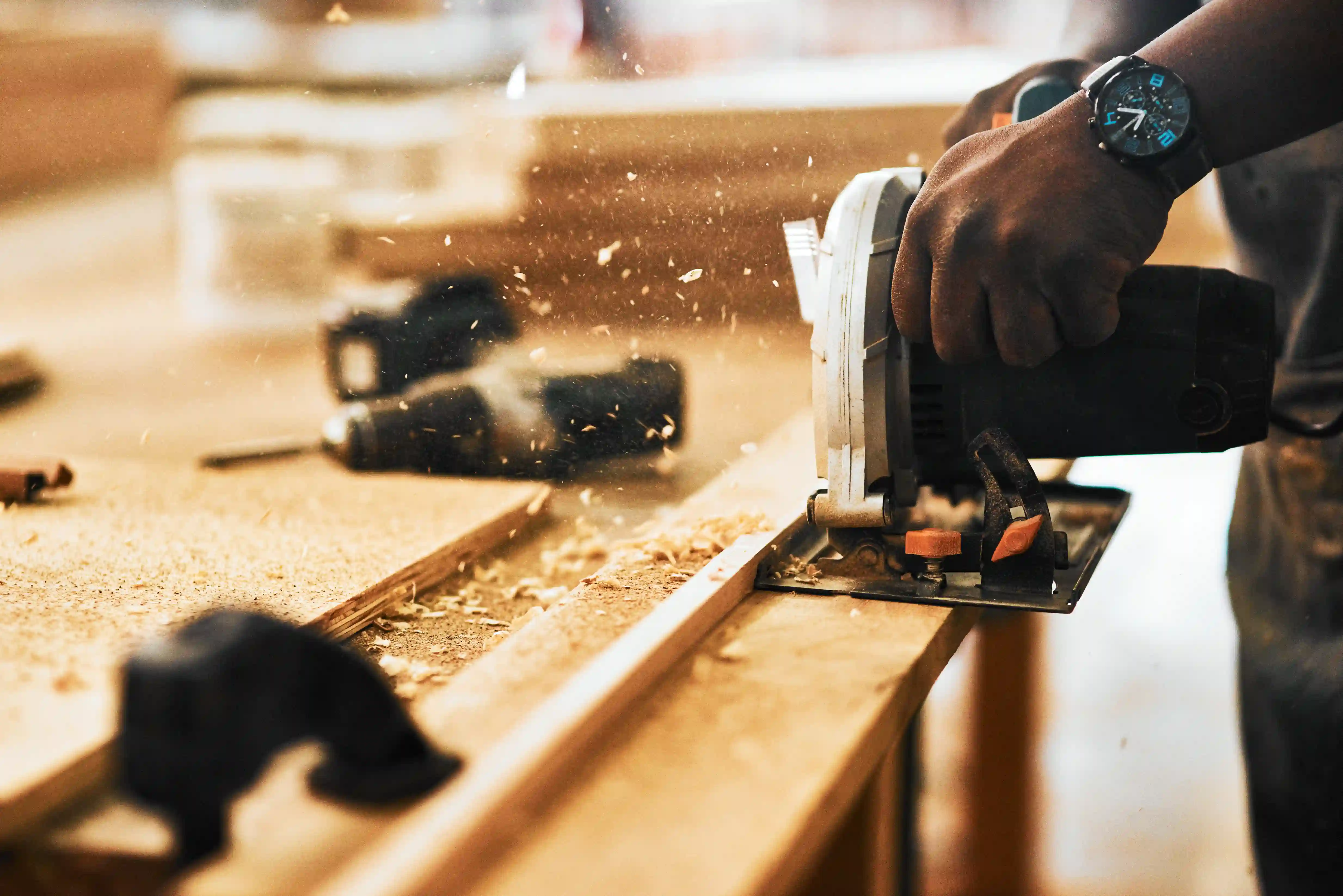 Carpenter using a circular saw to cut wood