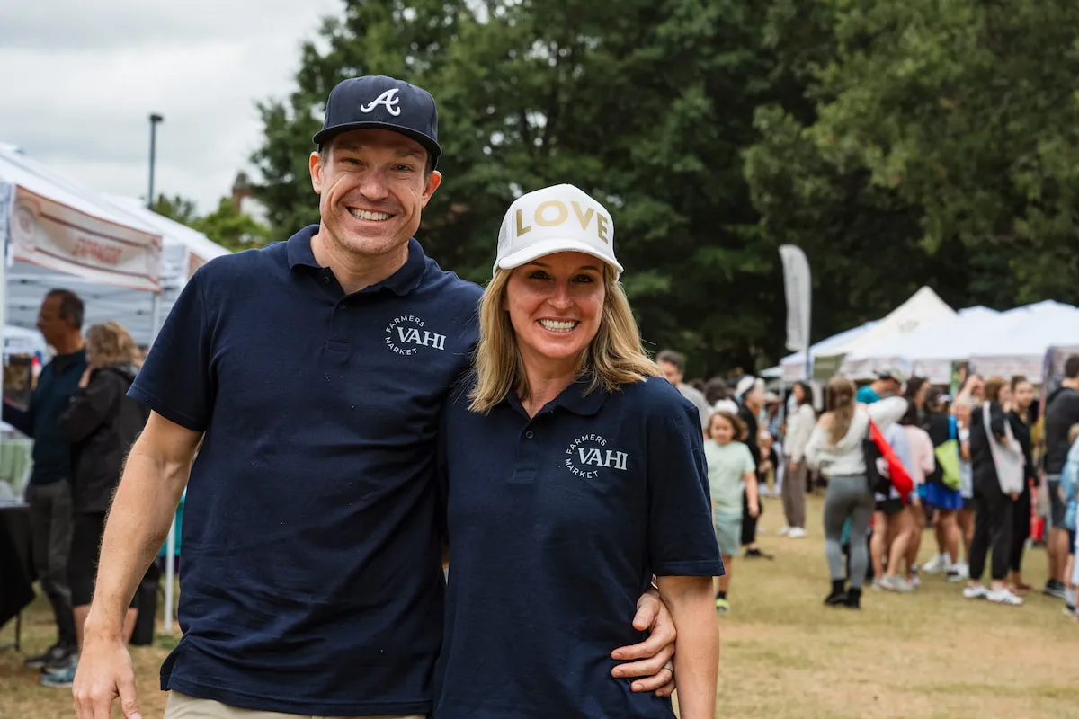 Committee Members Lindsay and Tyler Wheeler wear their VaHi Farmers Market shirts at the market.