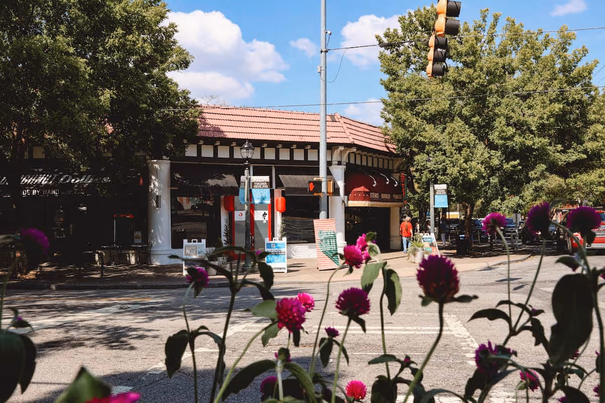 Flowers bloom in the spring along the Virginia Ave and North Highland Ave intersection.
