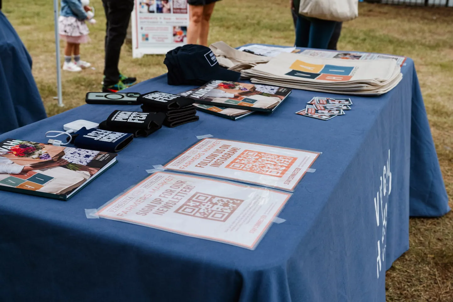 The Farmers Market info booth is the perfect place to find merch, market information, volunteer opportunities, and other ways to get involved.