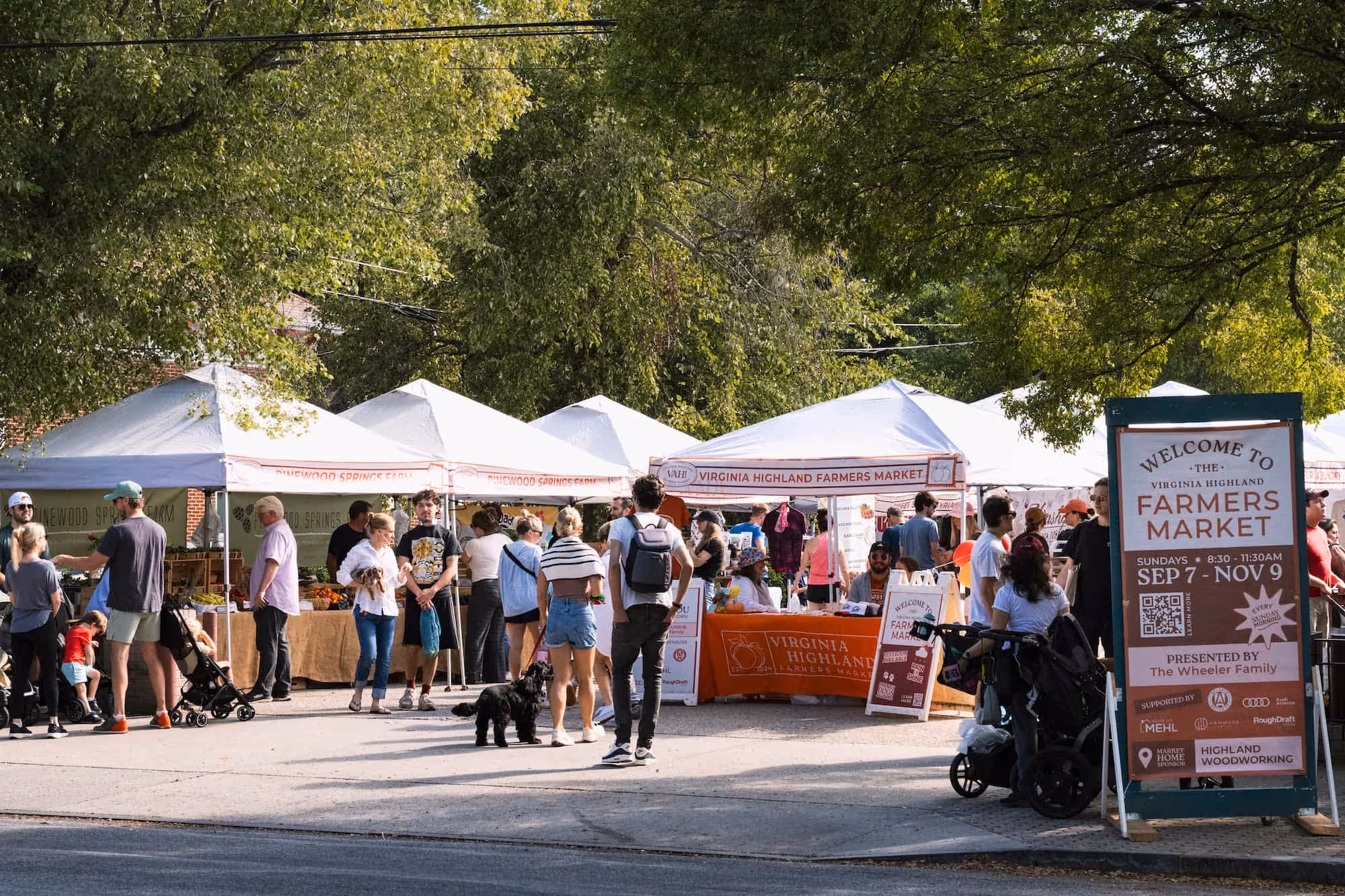 Neighbors shop at the Virginia Highland Farmers Market for fresh produce, baked goods, meat and seafood, and more.