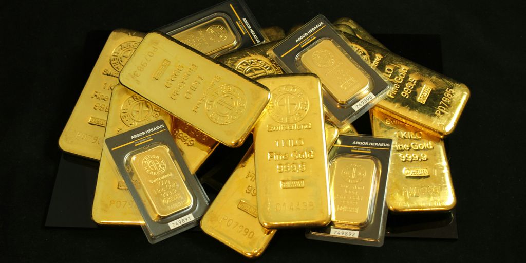 a pile of gold bars sitting on top of a table
