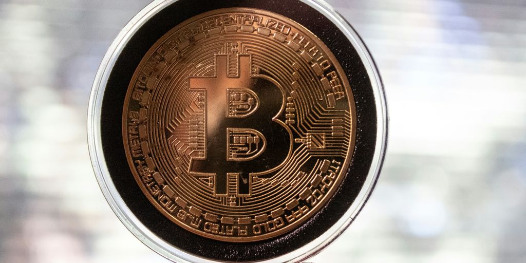 gold and black round coin