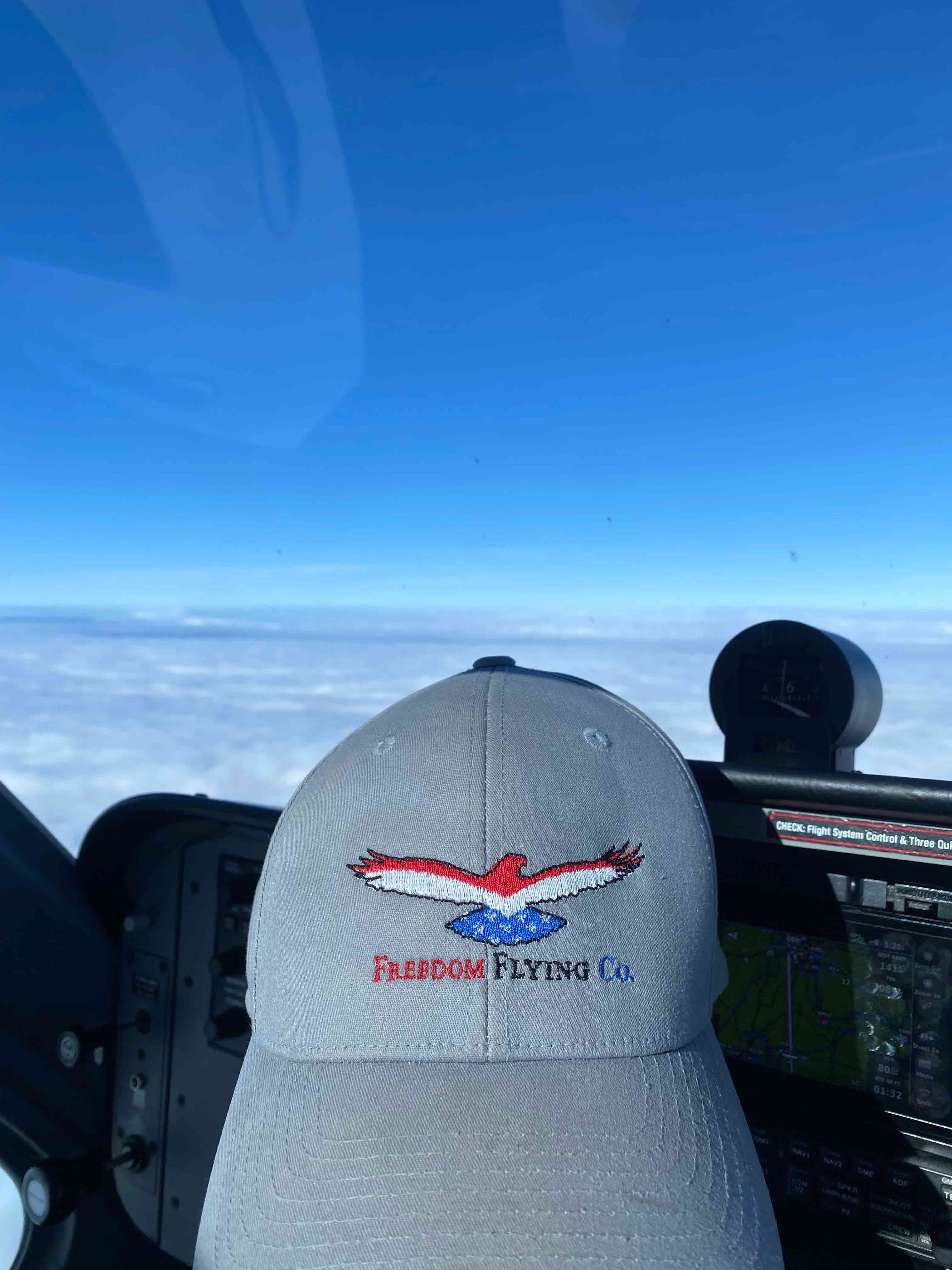 ffc hat on dashboard of plane