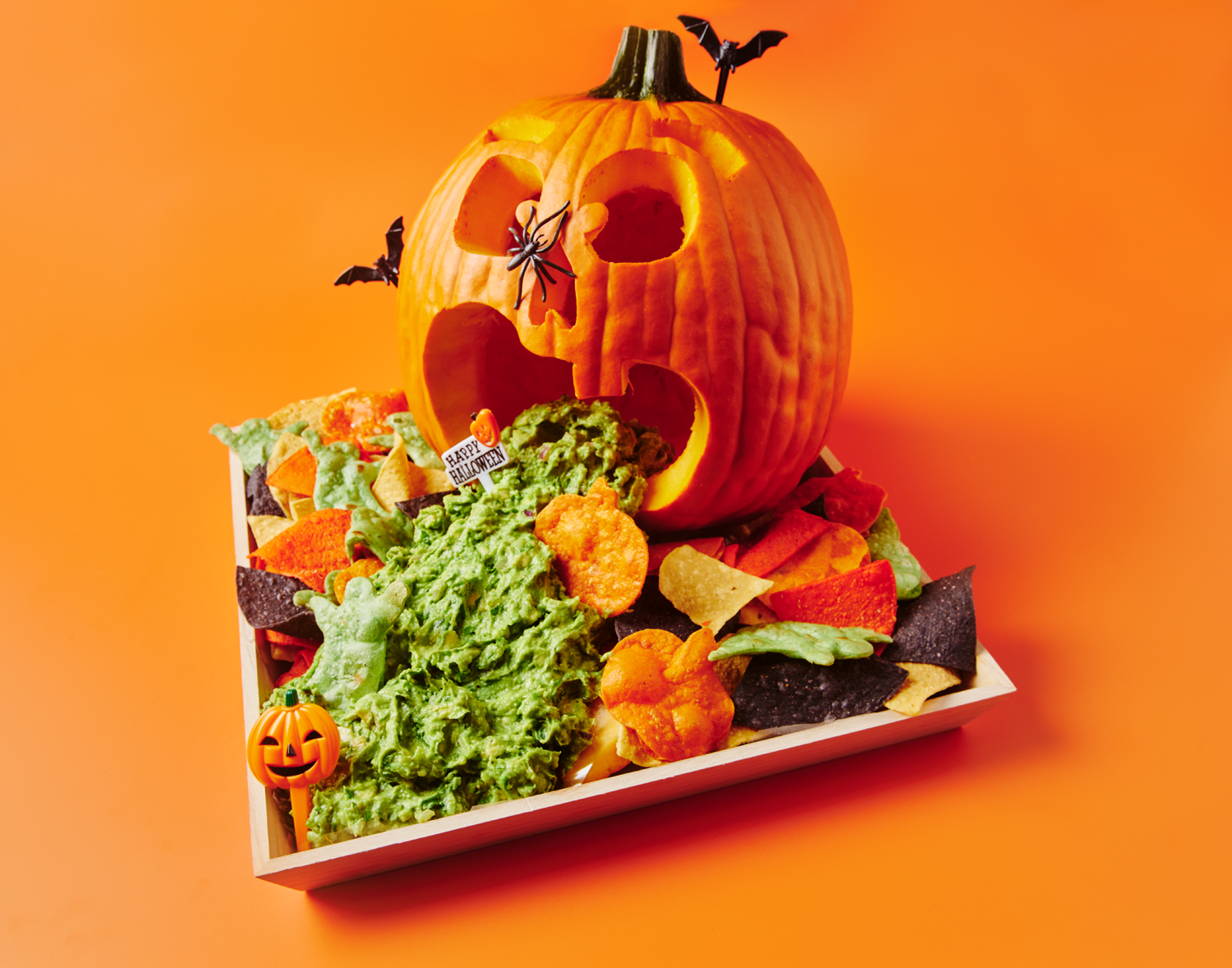 Jack O'Lantern guacamoldy with tortilla chips