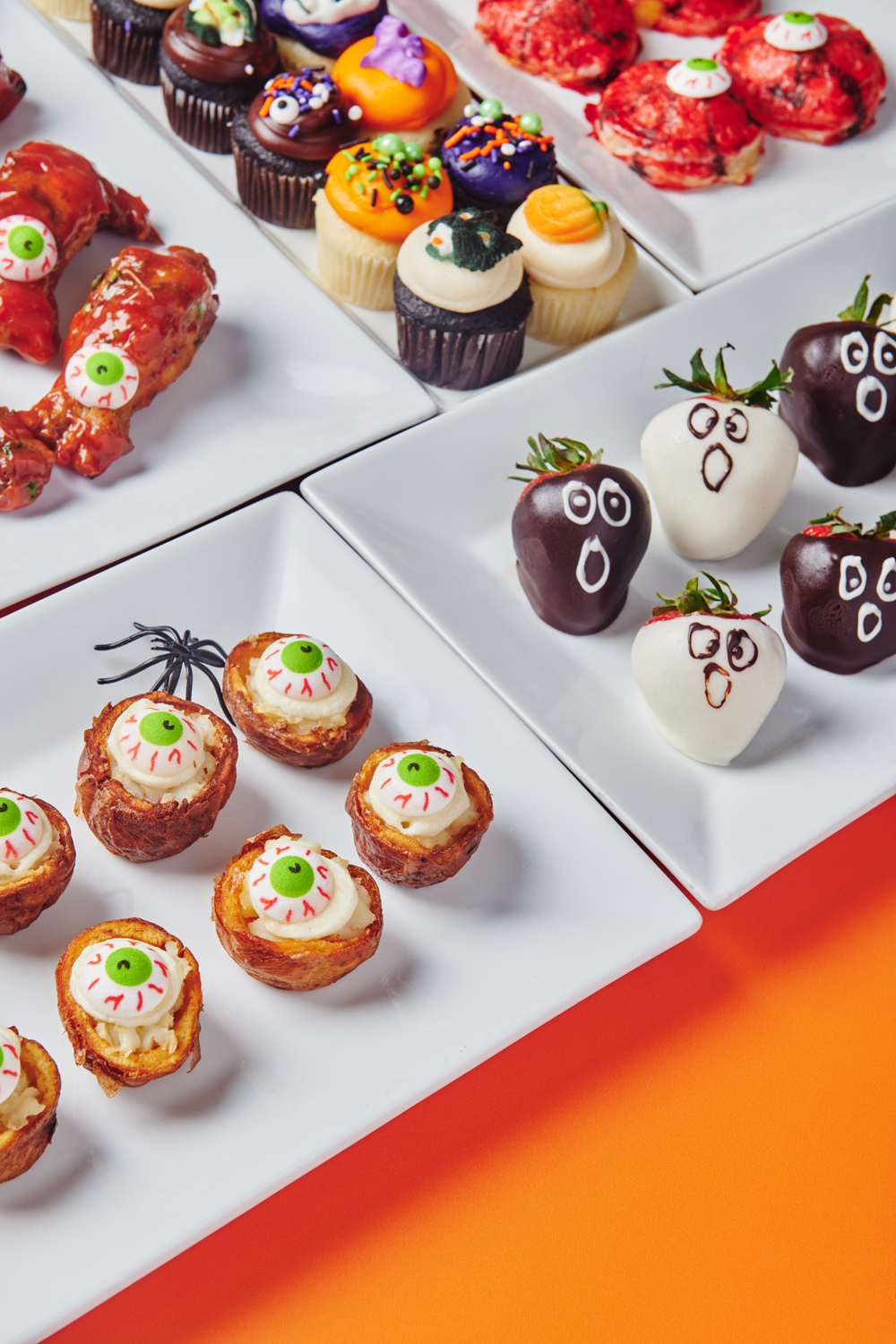Halloween catering spread with themed bites and desserts