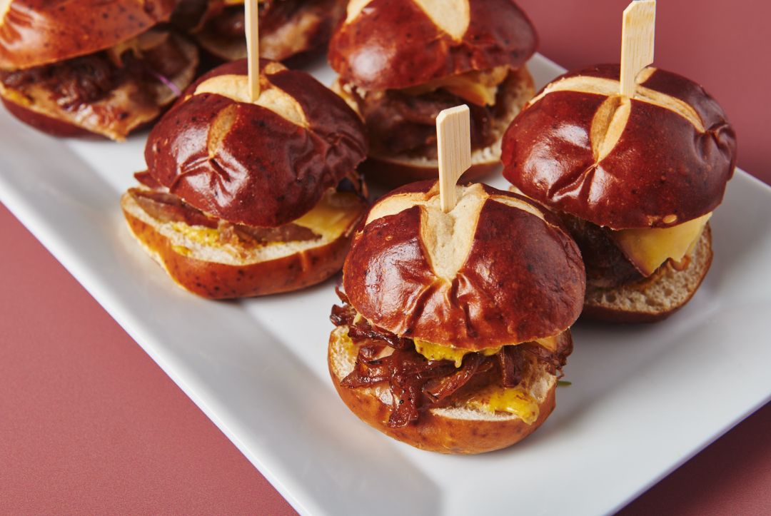 Bratwurst sliders on pretzel buns