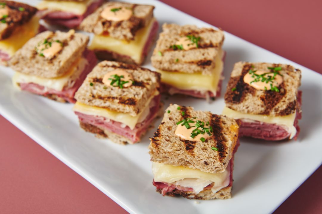 Mini Reuben sandwiches on grilled marble rye