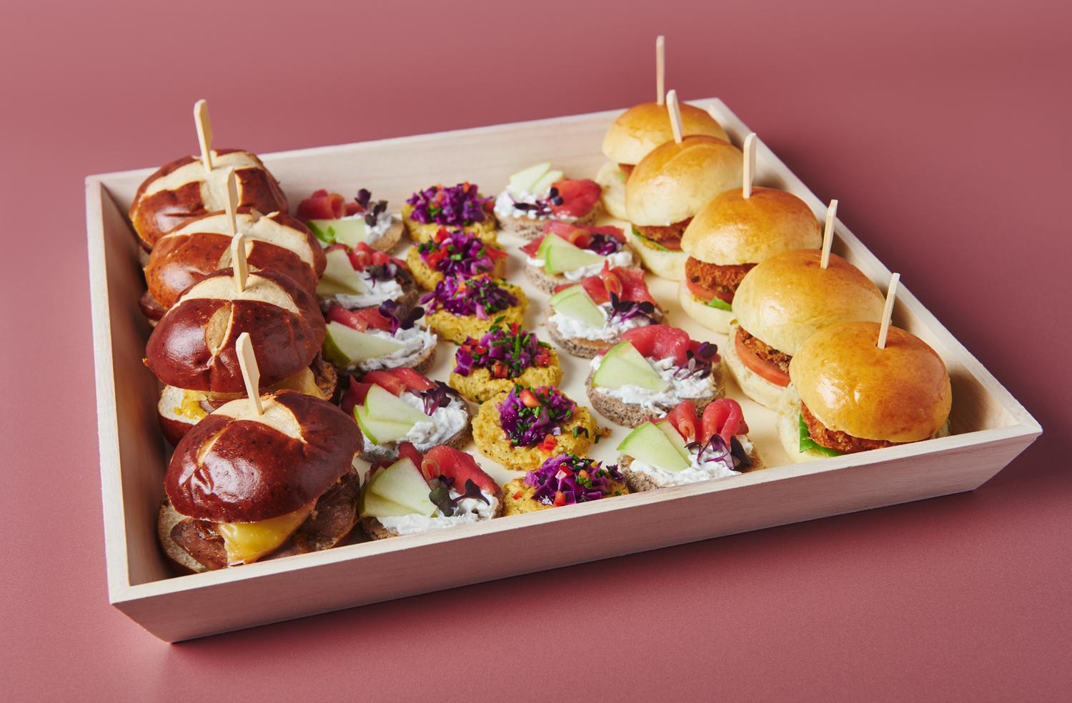 Oktoberfest hors d'oeuvres display with pretzel sliders and canapés