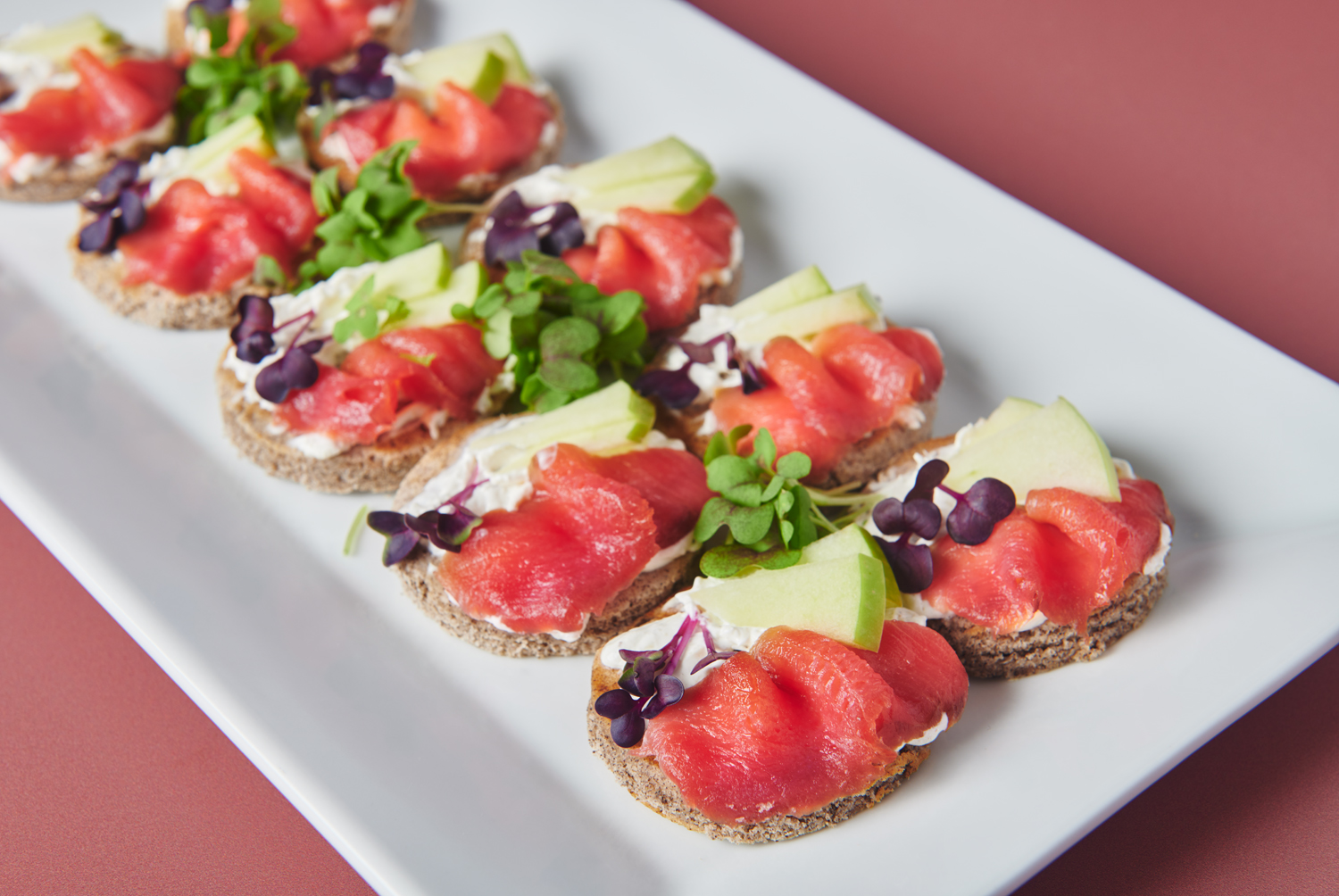 Beet cured salmon on buckwheat blini