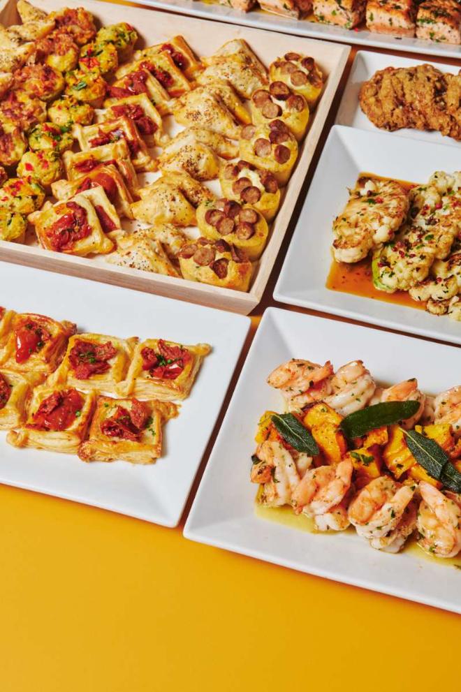 Fall catering spread with puff pastry bites, cauliflower steak, shrimp with sage and butternut squash