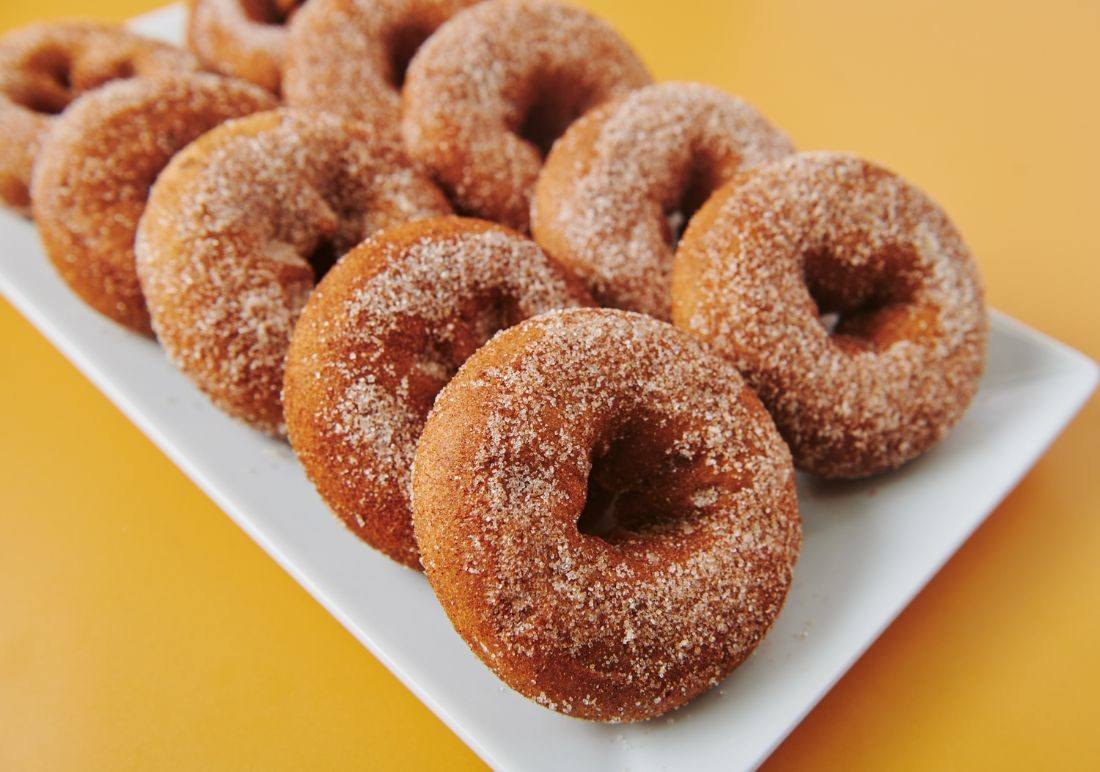 Apple cider donuts dusted in cinnamon sugar