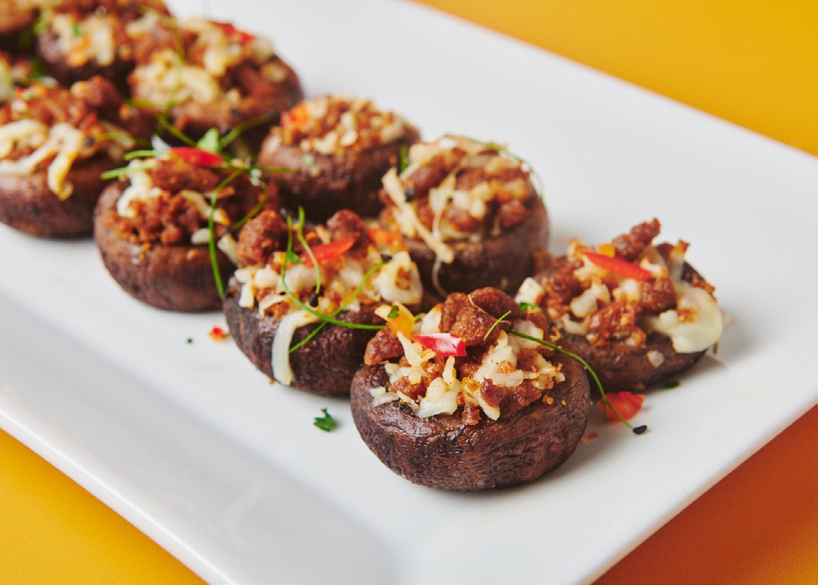 Vegan cheesy sausage stuffed mushrooms