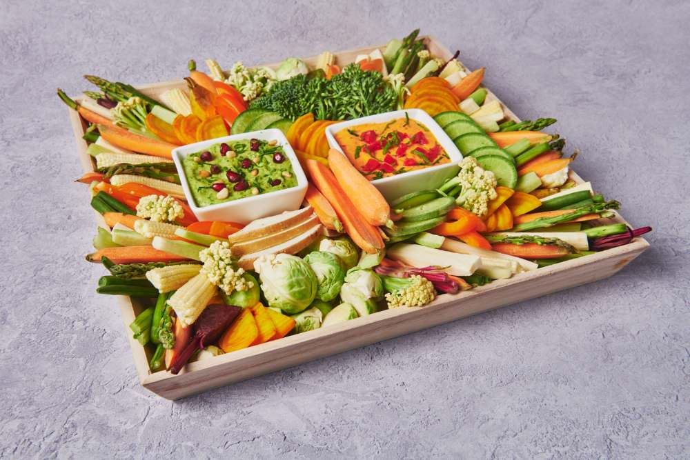 Crudité board with seasonal raw vegetables and dips