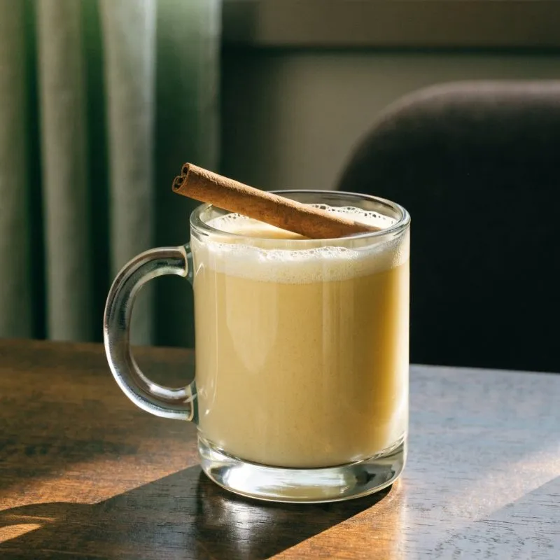 Classic eggnog with a cinnamon stick