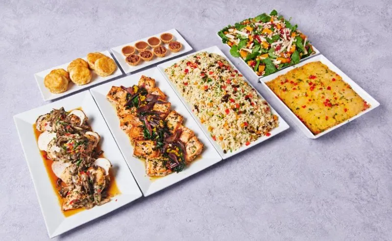 Festive Feast #2 buffet with sautéed chicken breast, salmon with braised Swiss chard, rice pilaf and harvest salad