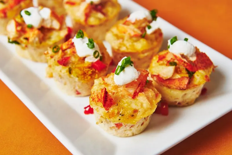 Lobster mac and cheese bites on a tray