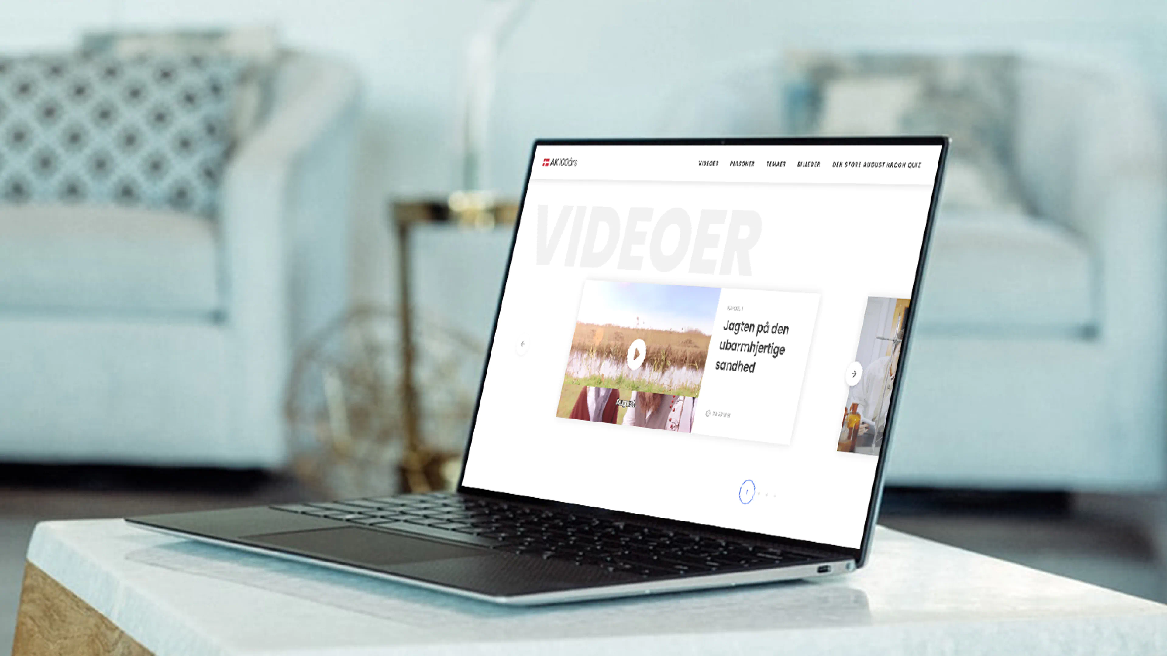 MacBook Air mockup displaying the August Krogh interactive website video page, featuring historical films and stories about his legacy.