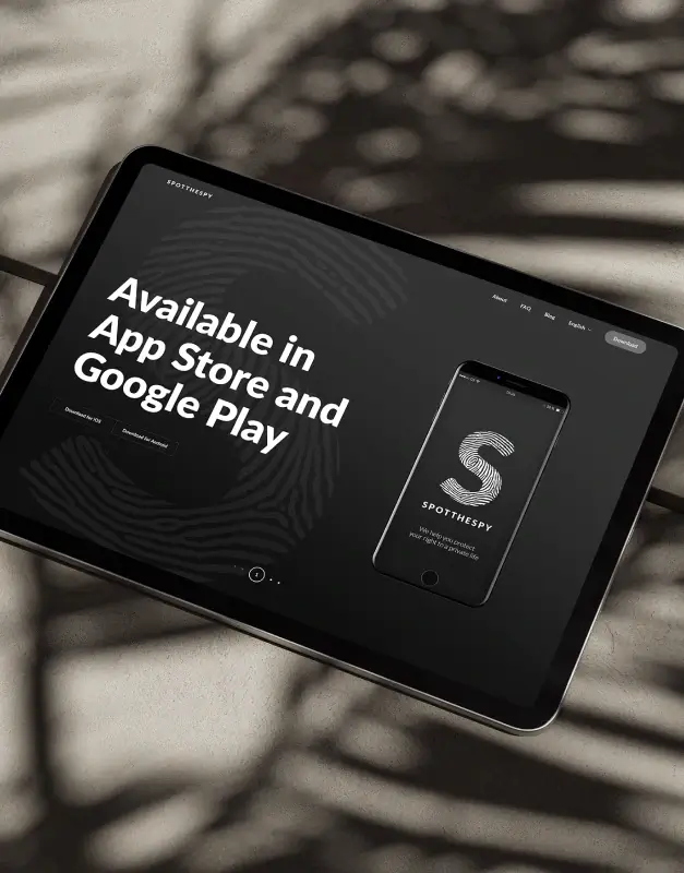 SPOTTHESPY website shown on a tablet, presenting a dark interface, fingerprint-led branding, and app download messaging for a security-focused digital product experience.