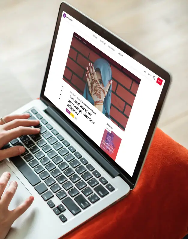 Bibelselskabet website displayed on a laptop, presenting an editorial digital experience with strong imagery, thoughtful typography, and a clear content-led structure.