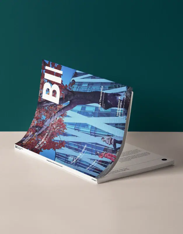 BioInnovation Institute printed magazine shown in a styled mock-up, highlighting editorial design, brand communication, and a polished publication identity.
