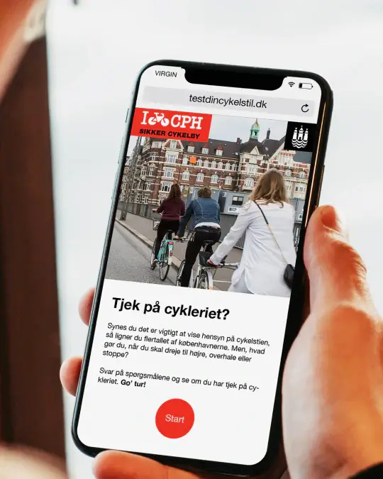 Mobile view of Copenhagen Municipality’s cycling awareness quiz, showing the intro screen for a digital campaign about safe bicycle behavior in city traffic.