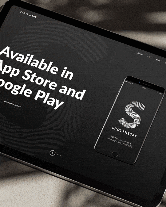 Animated SpotTheSpy website visual showing a dark product landing page with bold typography, app store availability, and a smartphone mockup for the privacy app.