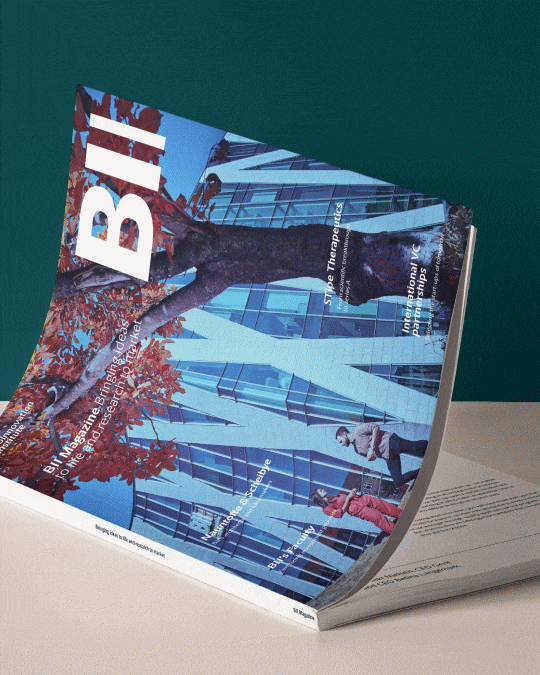 Animated BioInnovation Institute magazine mockup showing the publication from a side angle, highlighting the editorial format and printed report presentation.