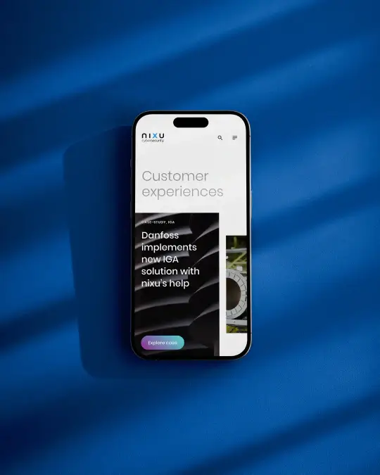 Nixu Cybersecurity mobile website customer experiences page featuring Danfoss IGA case study on smartphone against blue background