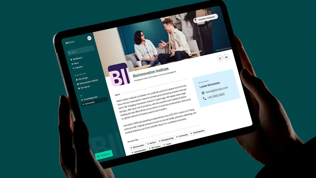BioInnovation Institute intranet community platform displayed on tablet showing organisation profile page with contact details and topic tags