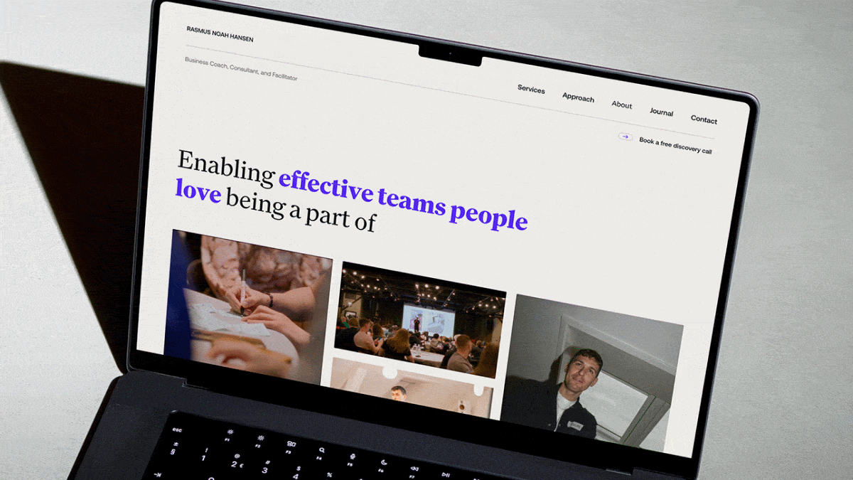 Rasmus Noah Hansen business coach and consultant personal website displayed on laptop with team facilitation photography and hero headline