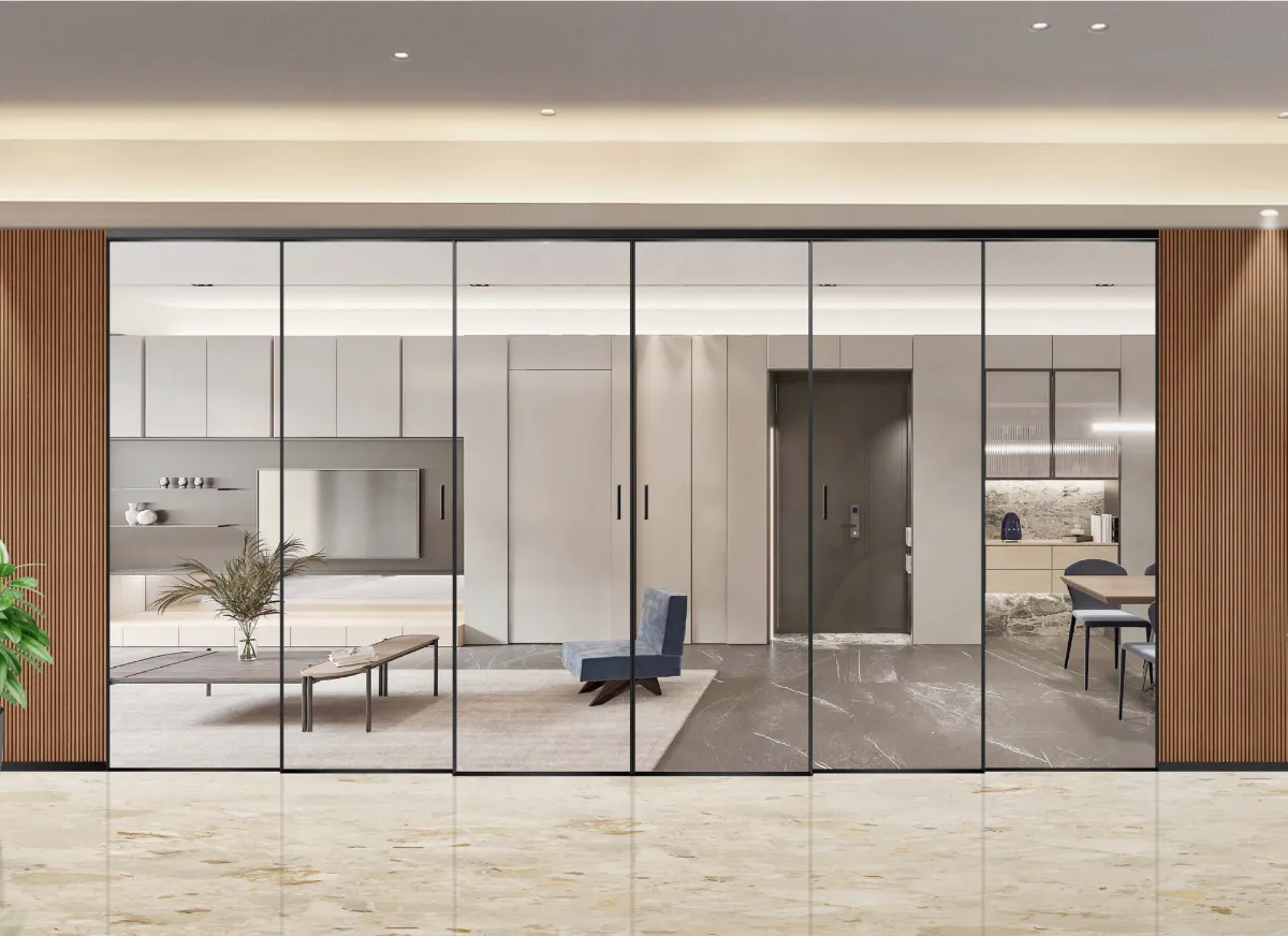 Modern living room and kitchen separated by black-framed glass sliding doors with wood paneling sides.
